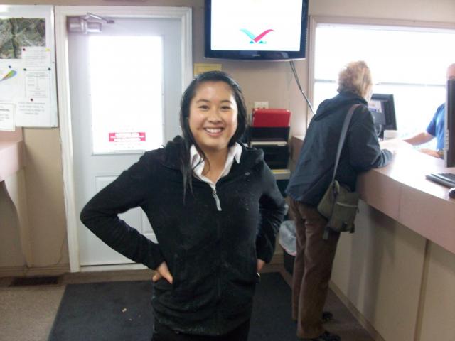 Ashley Ha tries to keep warm inside following her saturation: She does look happy despite the dampness!!